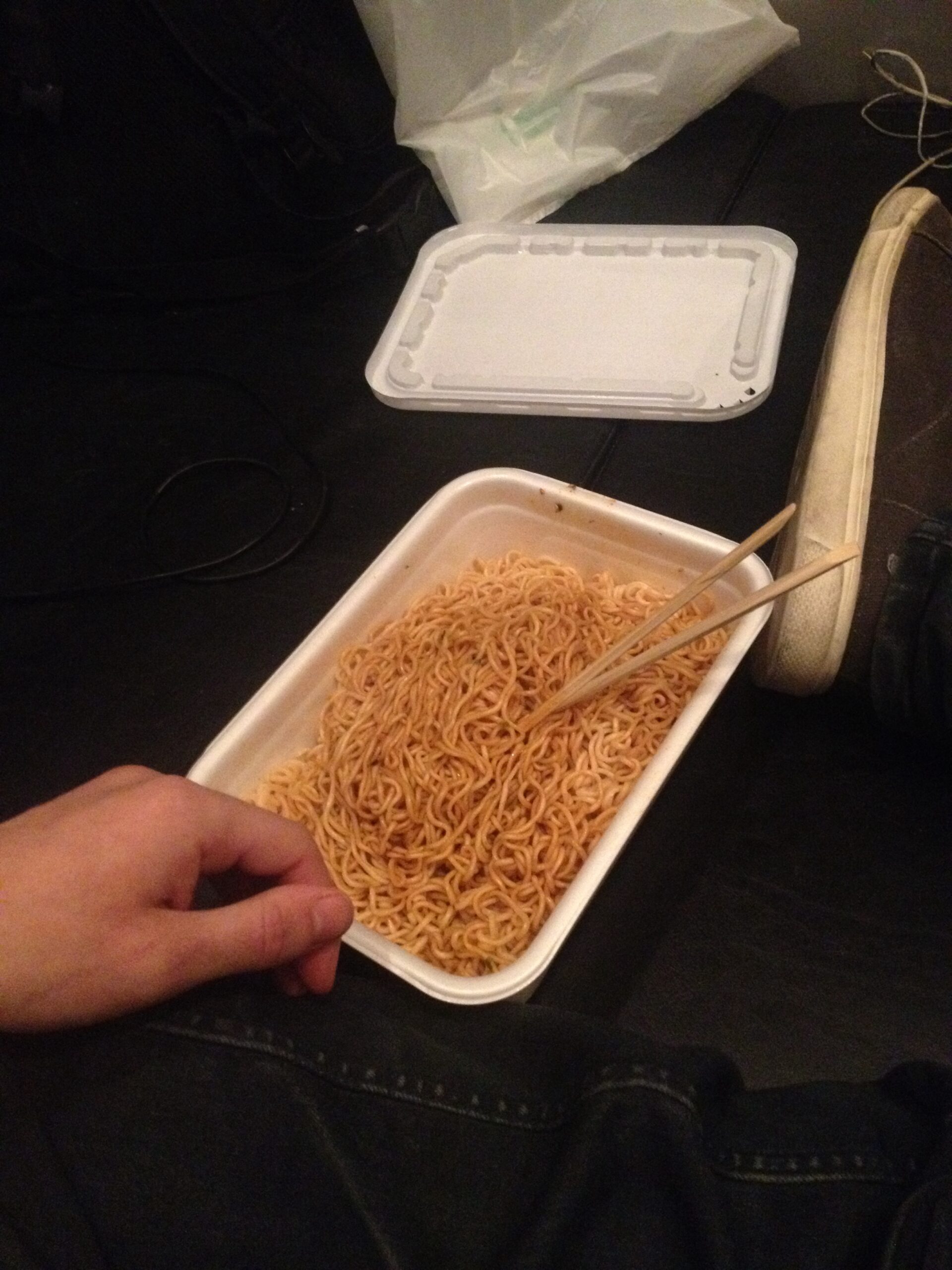 Brad Nicholls eating noodles in a Tokyo Net Room